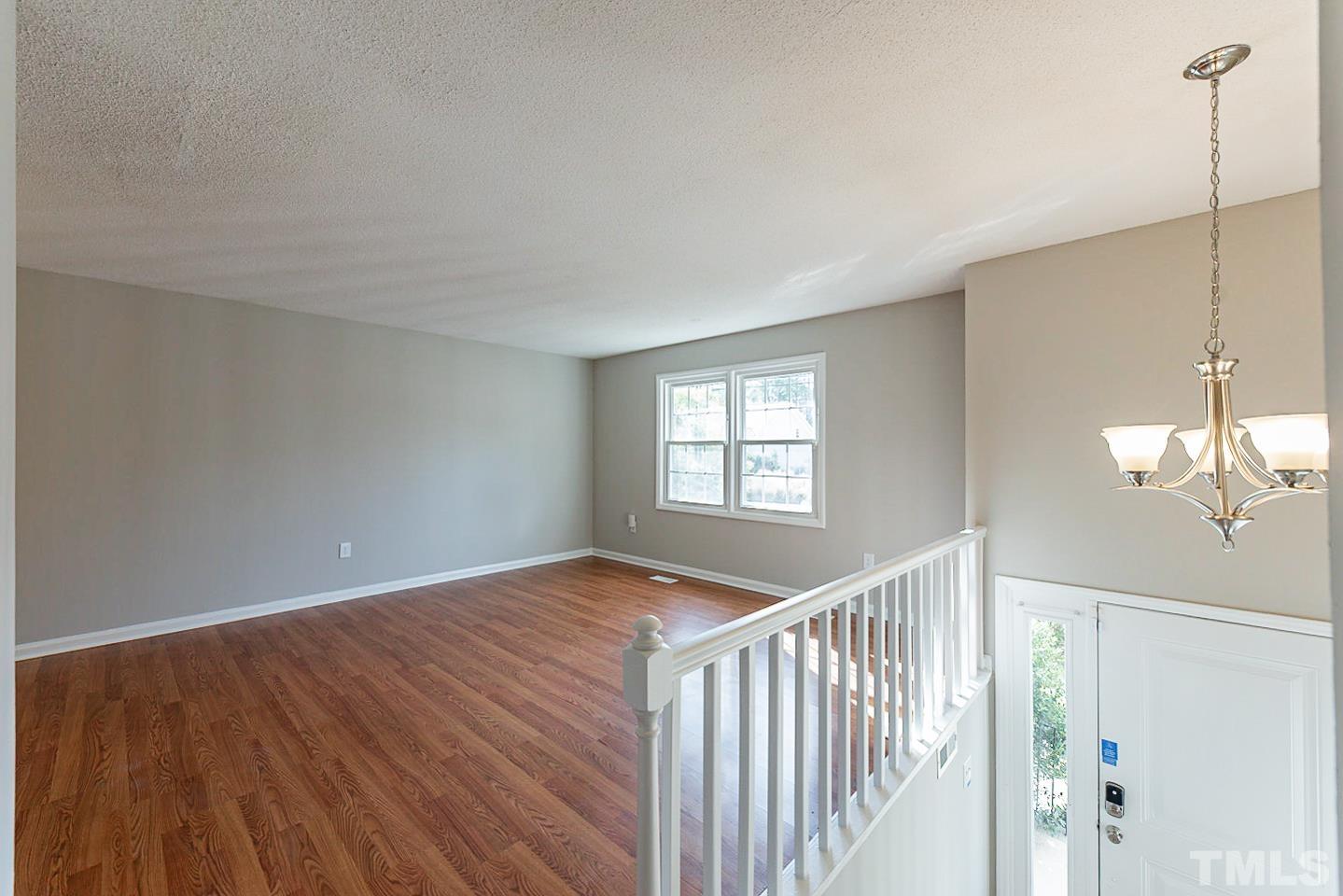 3601 Dixon Road Durham, NC 27707 - Photo 14 of 27 a view of a livingroom with wooden floor and a window