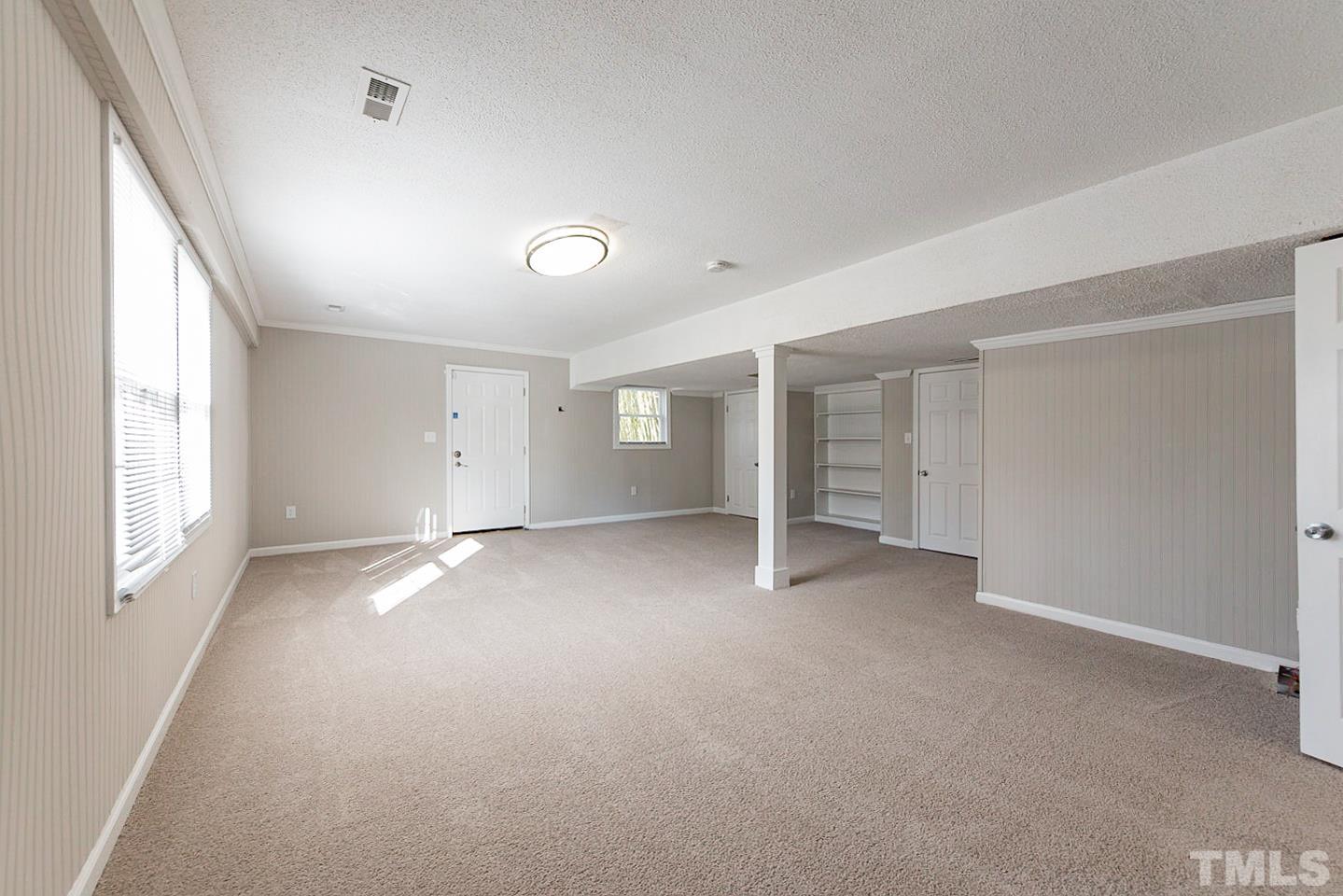 3601 Dixon Road Durham, NC 27707 - Photo 18 of 27 a view of empty room with a fireplace