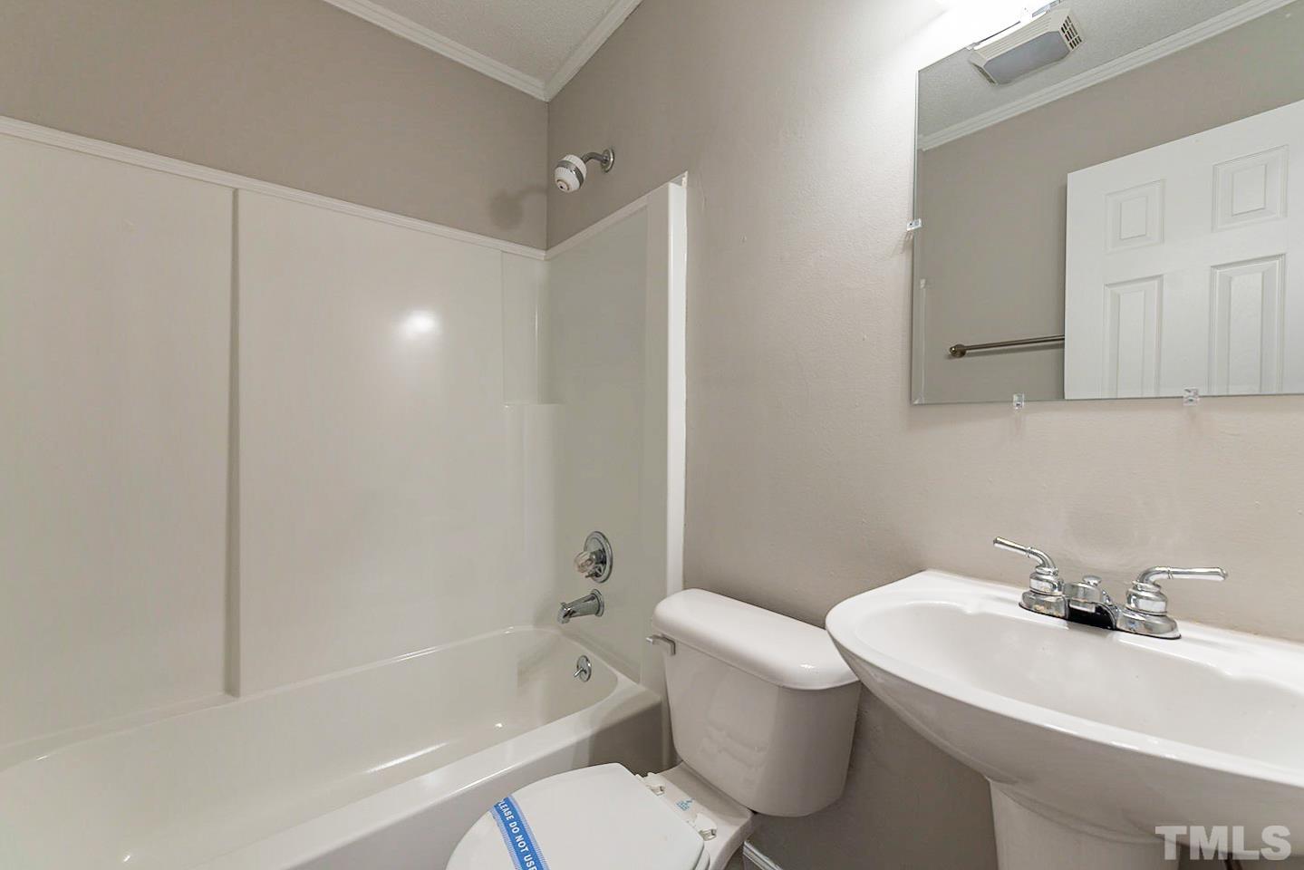 3601 Dixon Road Durham, NC 27707 - Photo 25 of 27 a bathroom with a sink toilet and bathtub
