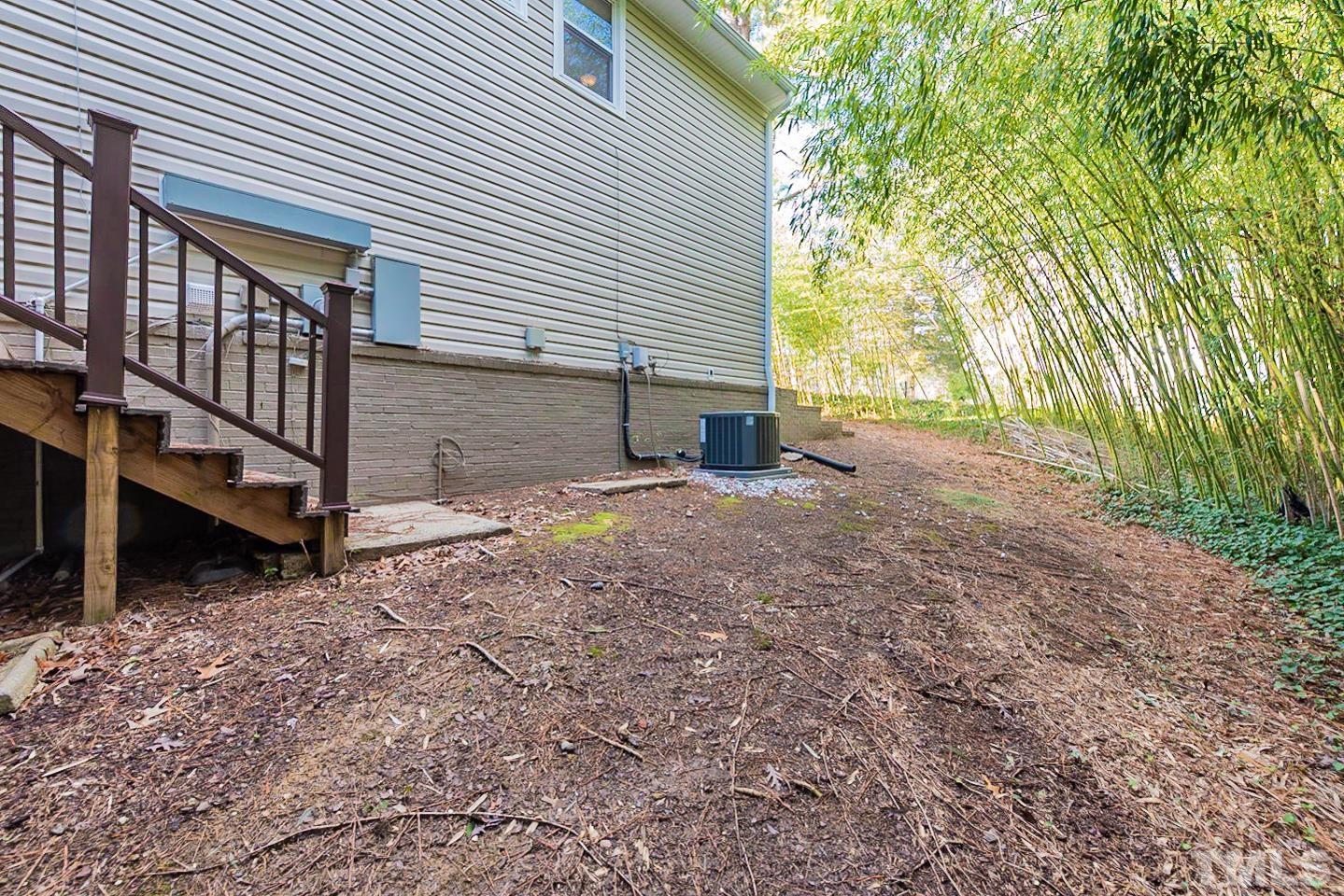 3601 Dixon Road Durham, NC 27707 - Photo 26 of 27 a view of a house with a yard and garage