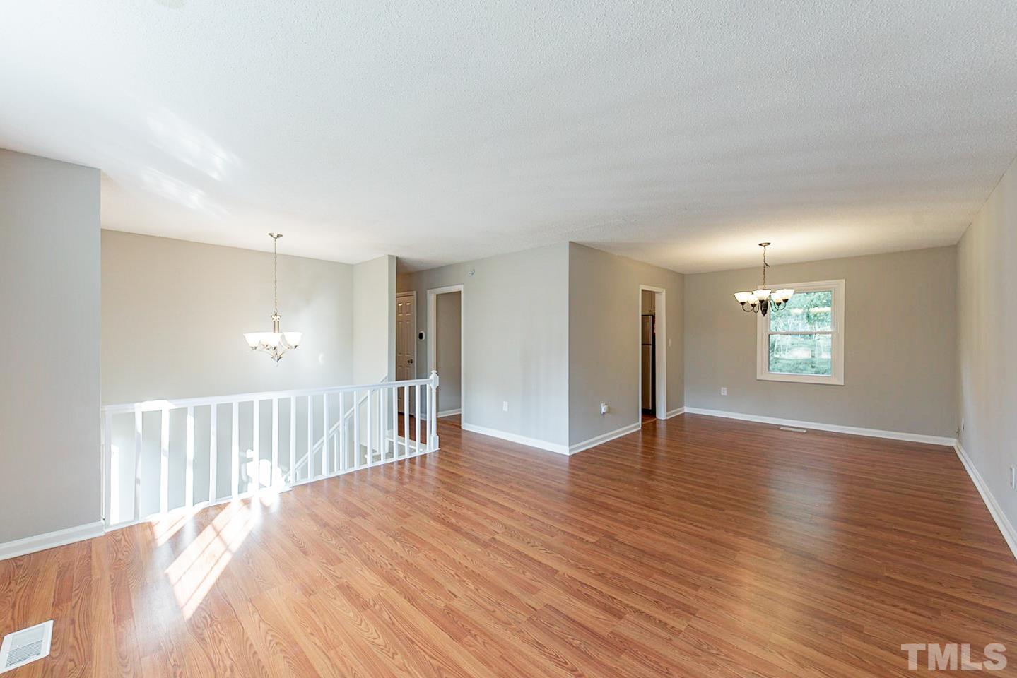 3601 Dixon Road Durham, NC 27707 - Photo 7 of 27 a view of a hallway with wooden floor and a window