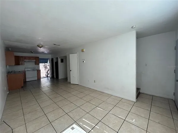 a view of a kitchen with a sink and a stove top oven