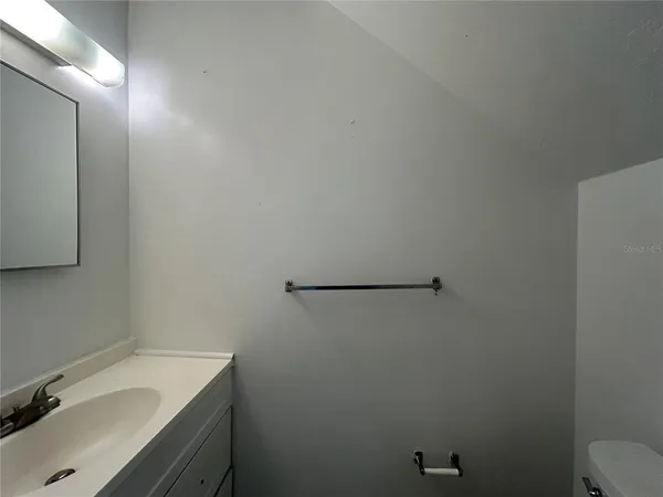 a bathroom with a sink and vanity