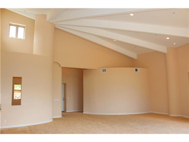 6391 West Lilac Road Bonsall, CA 92003 - Photo 4 of 10 Unique custom styling. The living is huge with vaulted ceilings. Features include designer paint, upgraded carpeting, recessed lighting, great views, etc.