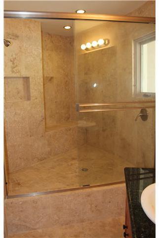 6391 West Lilac Road Bonsall, CA 92003 - Photo 7 of 10 Baths have travertine tile surround, and granite topped wood cabinets.