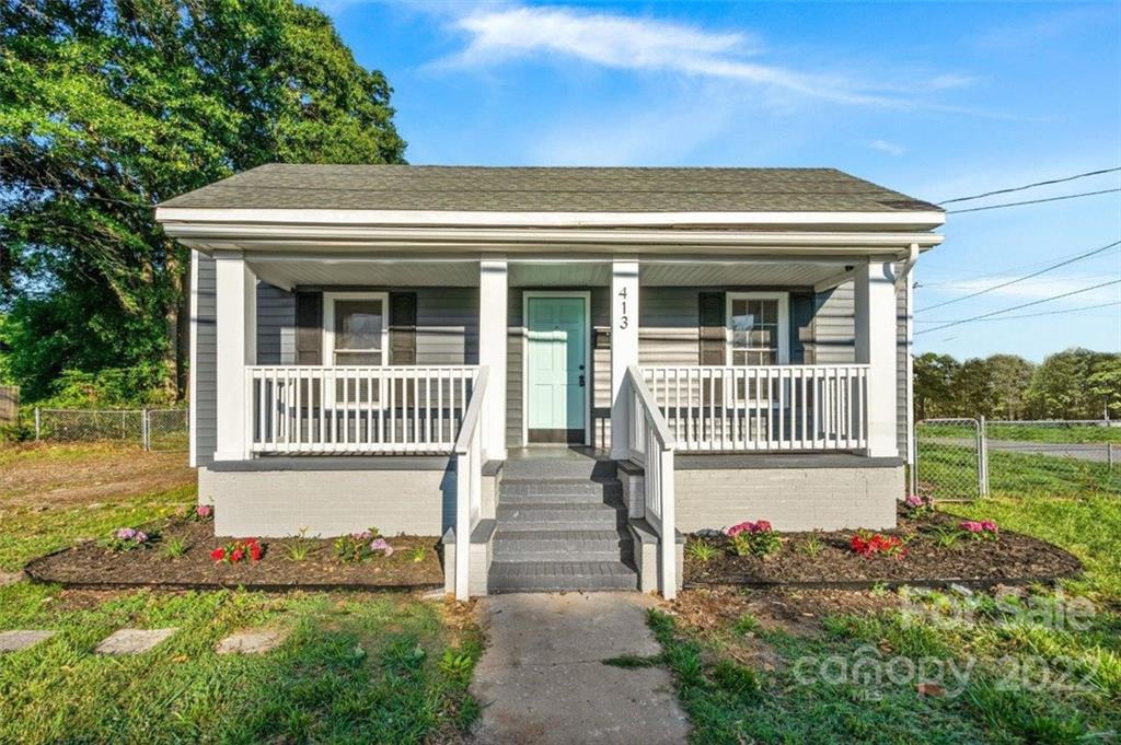 413 Modena Street Gastonia, NC 28054 - Photo 1 of 22 a front view of a house with a yard