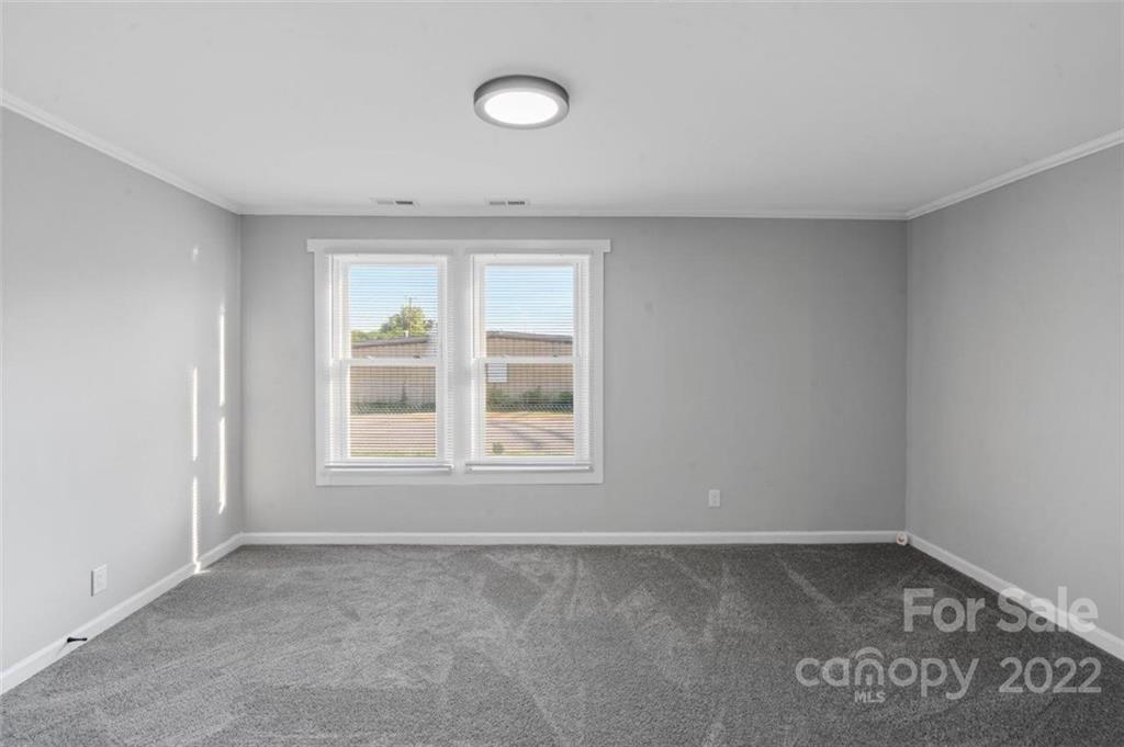 413 Modena Street Gastonia, NC 28054 - Photo 13 of 22 an empty room with a window