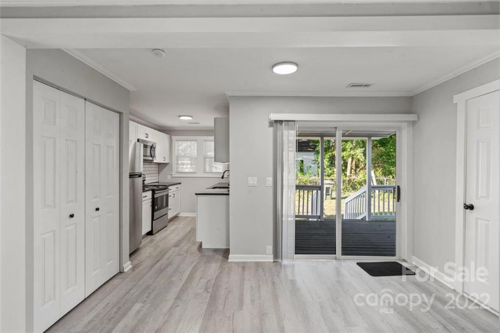 413 Modena Street Gastonia, NC 28054 - Photo 14 of 22 a view of a kitchen with wooden floor and a sink