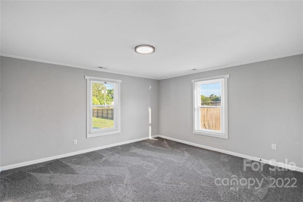 413 Modena Street Gastonia, NC 28054 - Photo 22 of 22 an empty room with windows
