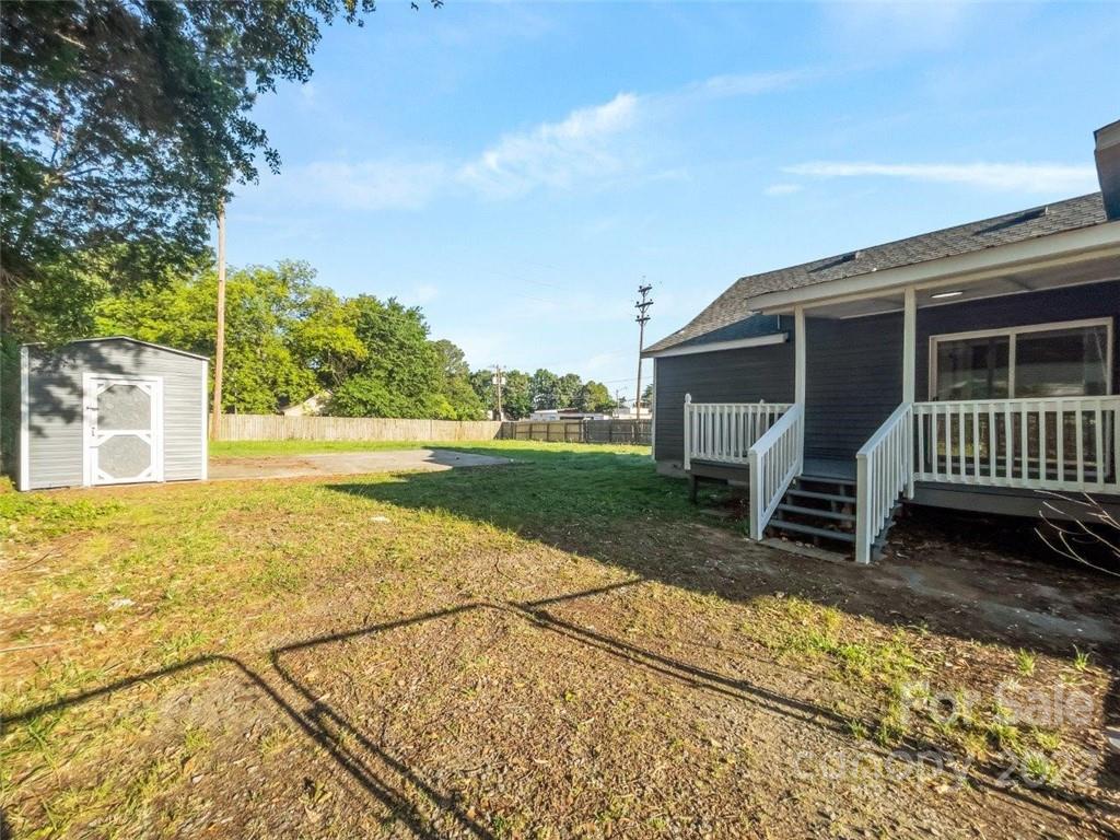 413 Modena Street Gastonia, NC 28054 - Photo 3 of 22 a view of a house with a yard