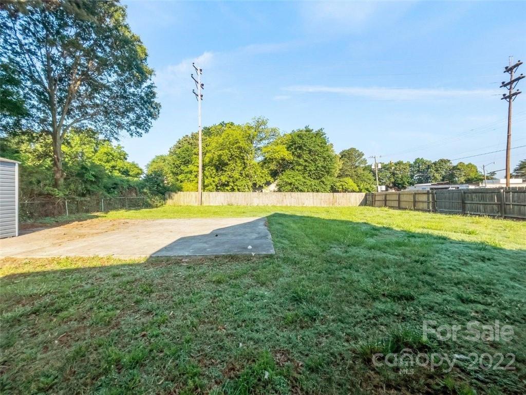 413 Modena Street Gastonia, NC 28054 - Photo 4 of 22 a view of yard with swimming pool and green space