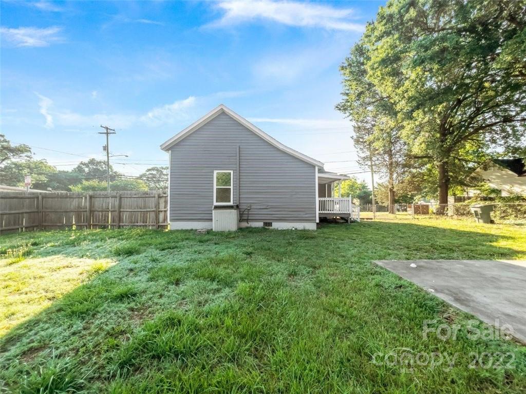 413 Modena Street Gastonia, NC 28054 - Photo 6 of 22 a view of a backyard with a garden