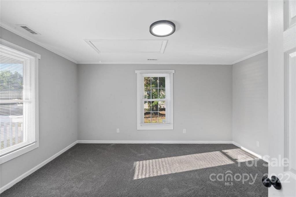 413 Modena Street Gastonia, NC 28054 - Photo 8 of 22 an empty room with windows