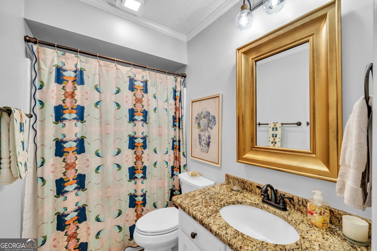 254 Valhalla Road South, Unit F Cordele, GA 31015 - Photo 25 of 41 a bathroom with a double vanity sink toilet and shower