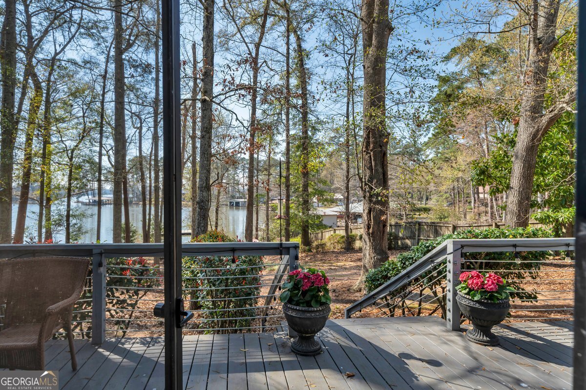 254 Valhalla Road South, Unit F Cordele, GA 31015 - Photo 29 of 41 a view of a balcony with wooden floor and outdoor seating