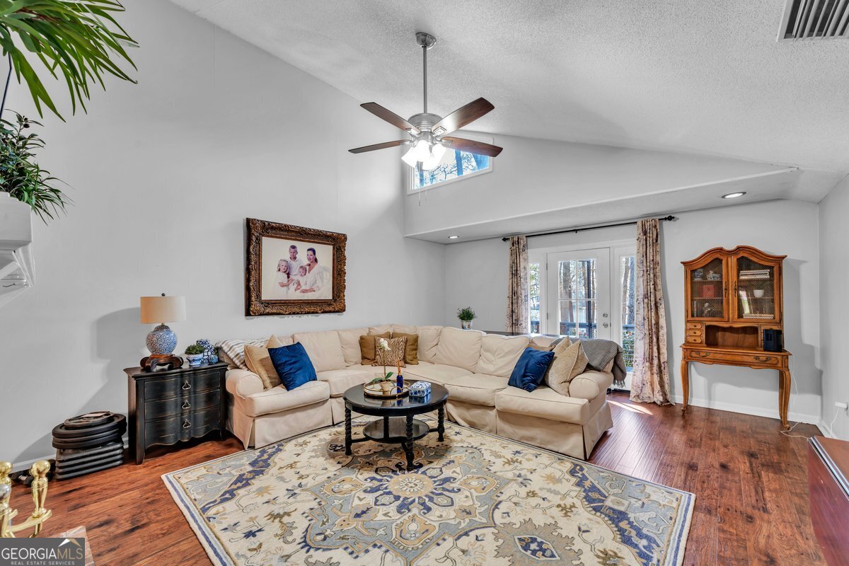254 Valhalla Road South, Unit F Cordele, GA 31015 - Photo 9 of 41 a living room with furniture and wooden floor
