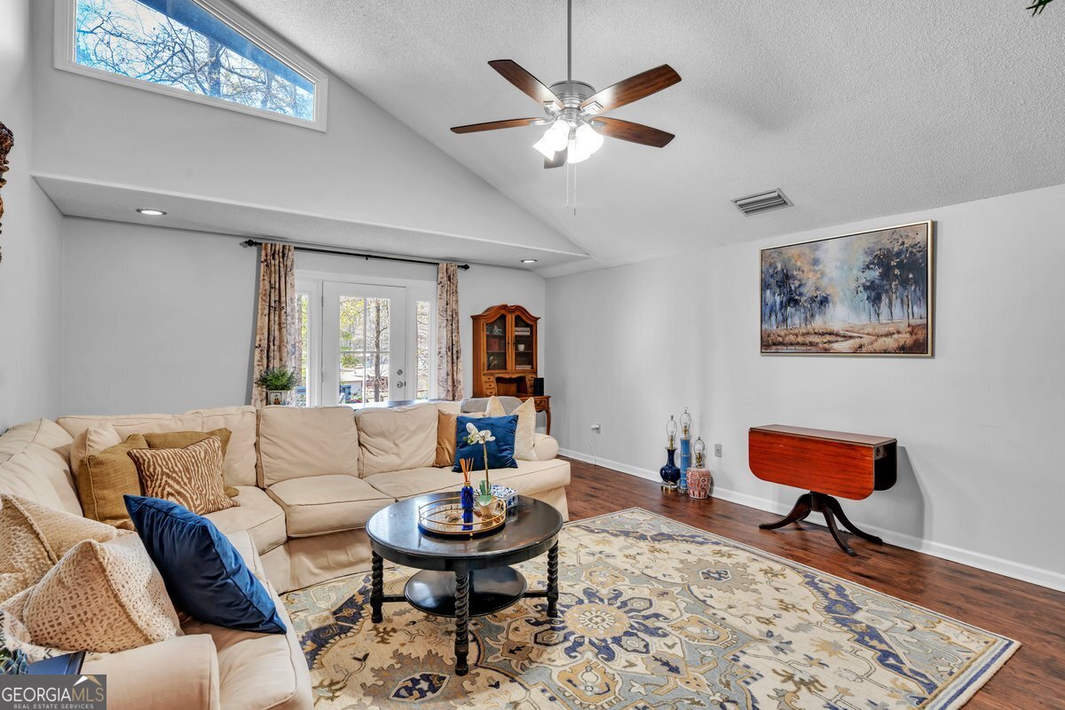 254 Valhalla Road South, Unit F Cordele, GA 31015 - Photo 10 of 41 a living room with furniture and a wooden floor