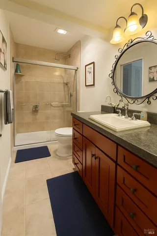 a bathroom with a double vanity sink and a mirror