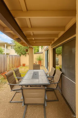 a swimming pool with outdoor seating and yard