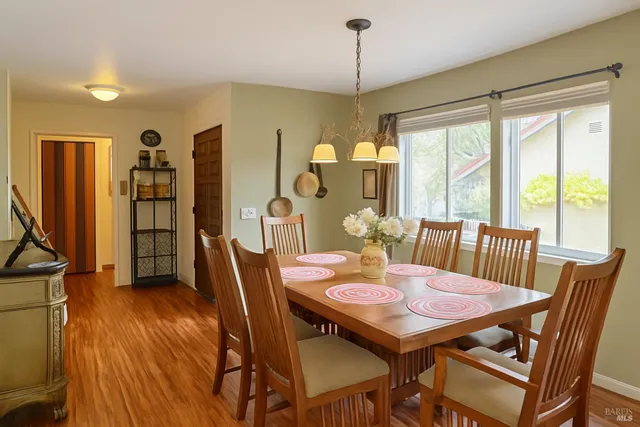 a view of a dining room with furniture window and outside view