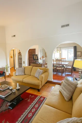 a living room with furniture and a table