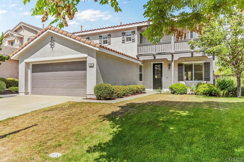 1297 Poplar Spring Road Chula Vista, CA 91915 - Photo 1 of 1 a view of a white house next to a yard with potted plants