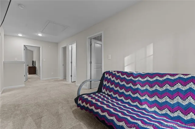 a bedroom with a bed and a chair