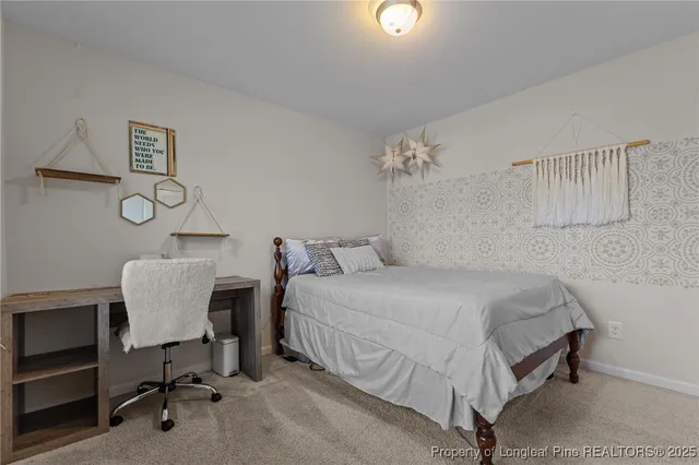 a bedroom with a bed and a chair