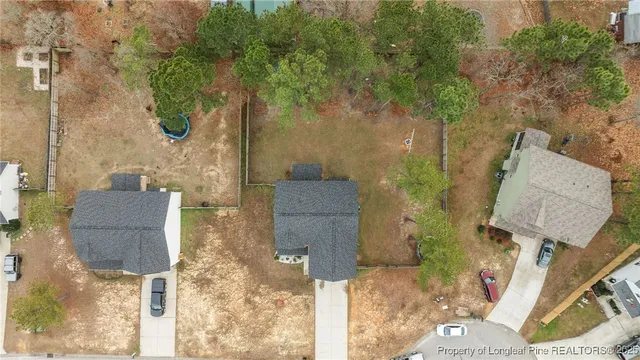 aerial view of a house with table and chairs