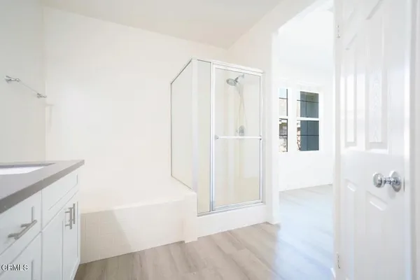 a bathroom with a bathtub and shower