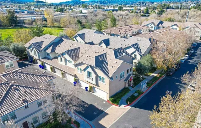 an aerial view of a house with a ocean view