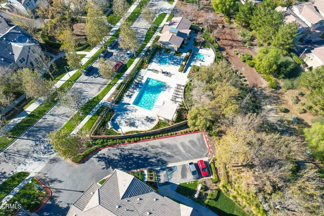 an aerial view of residential houses with outdoor space