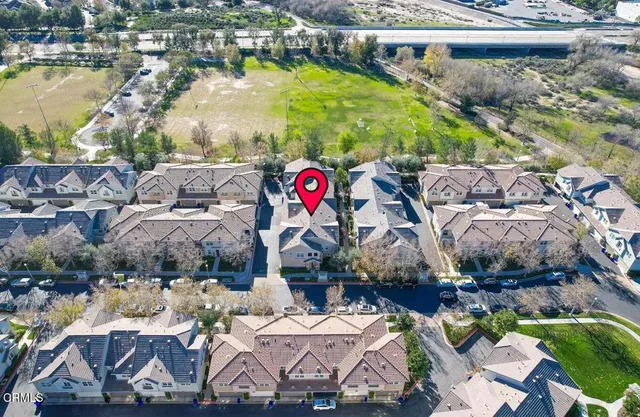a view of swimming pool with a yard and lake view