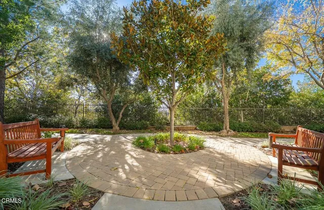 a view of a backyard with sitting area