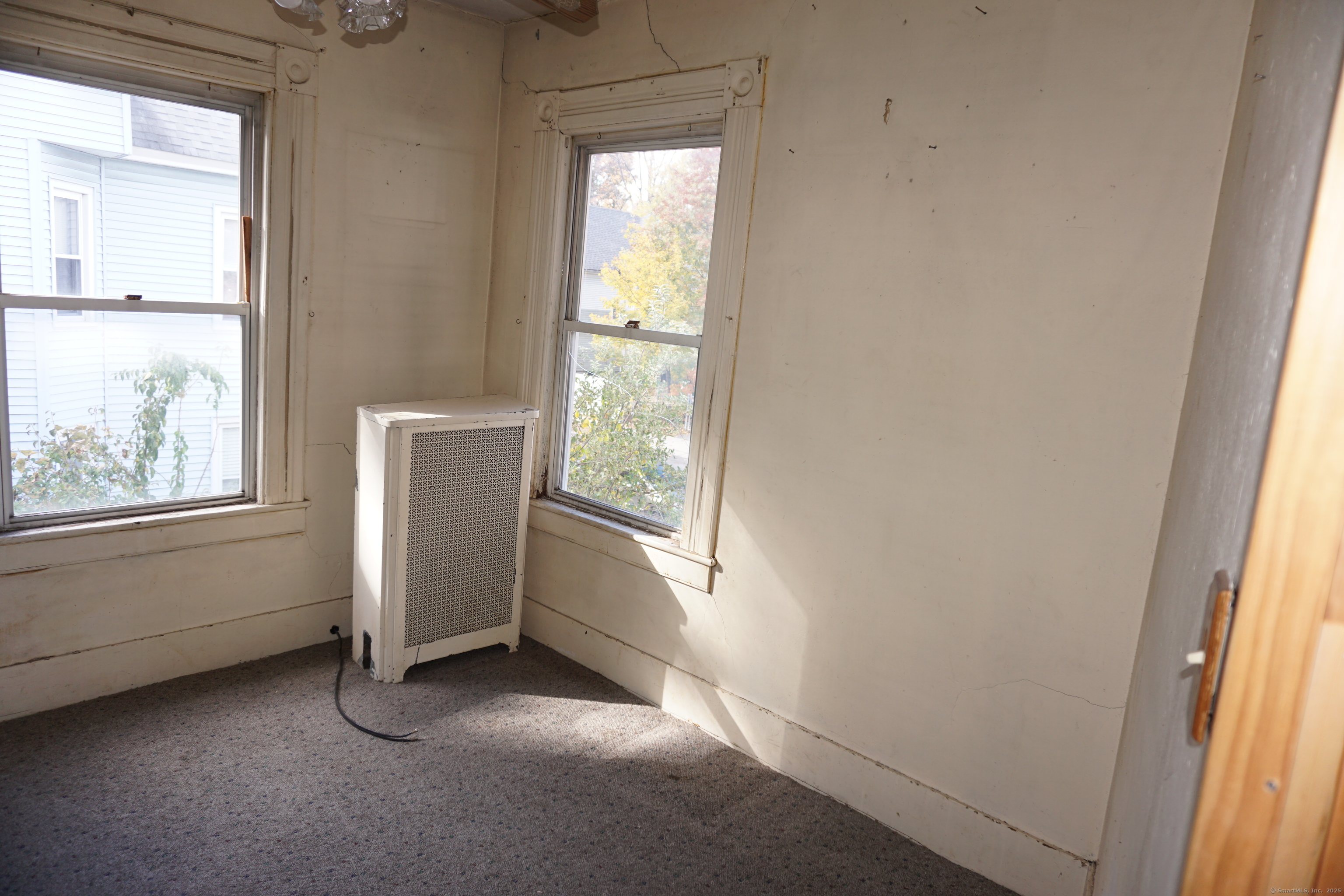 327 Orange Street Springfield, MA 01108 - Photo 12 of 32 a view of an empty room with a window