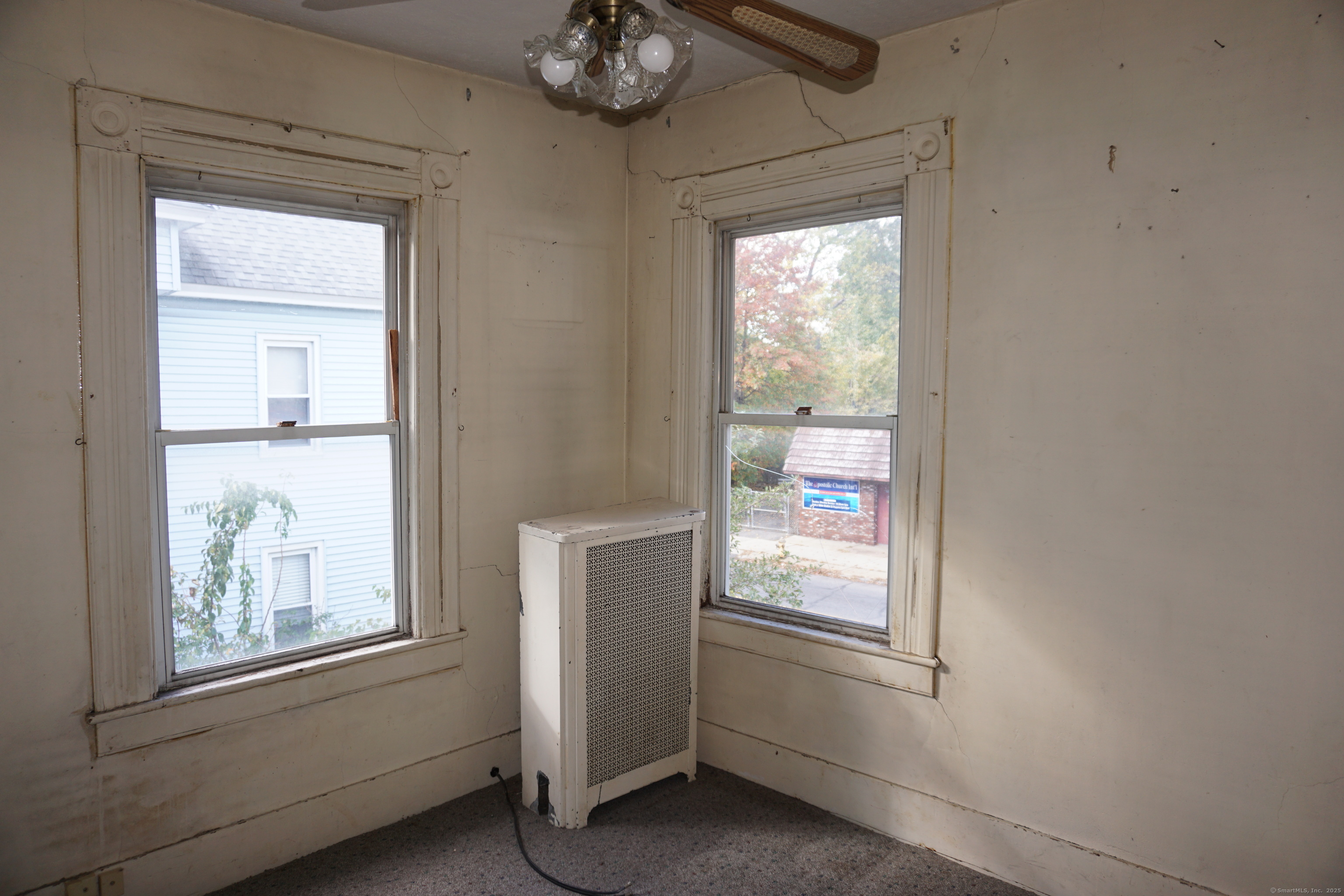 327 Orange Street Springfield, MA 01108 - Photo 15 of 32 a view of an empty room and window