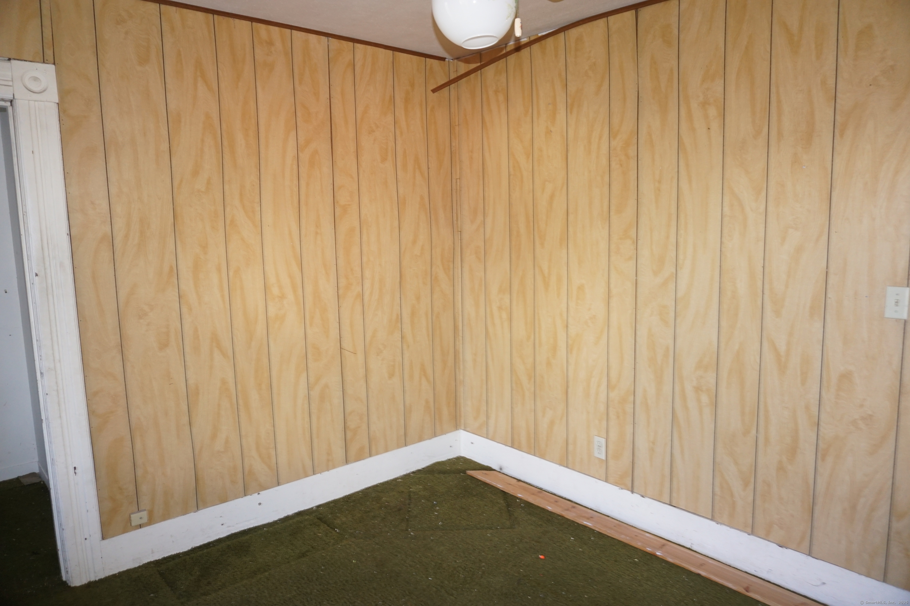327 Orange Street Springfield, MA 01108 - Photo 20 of 32 a view of a small room with wooden walls