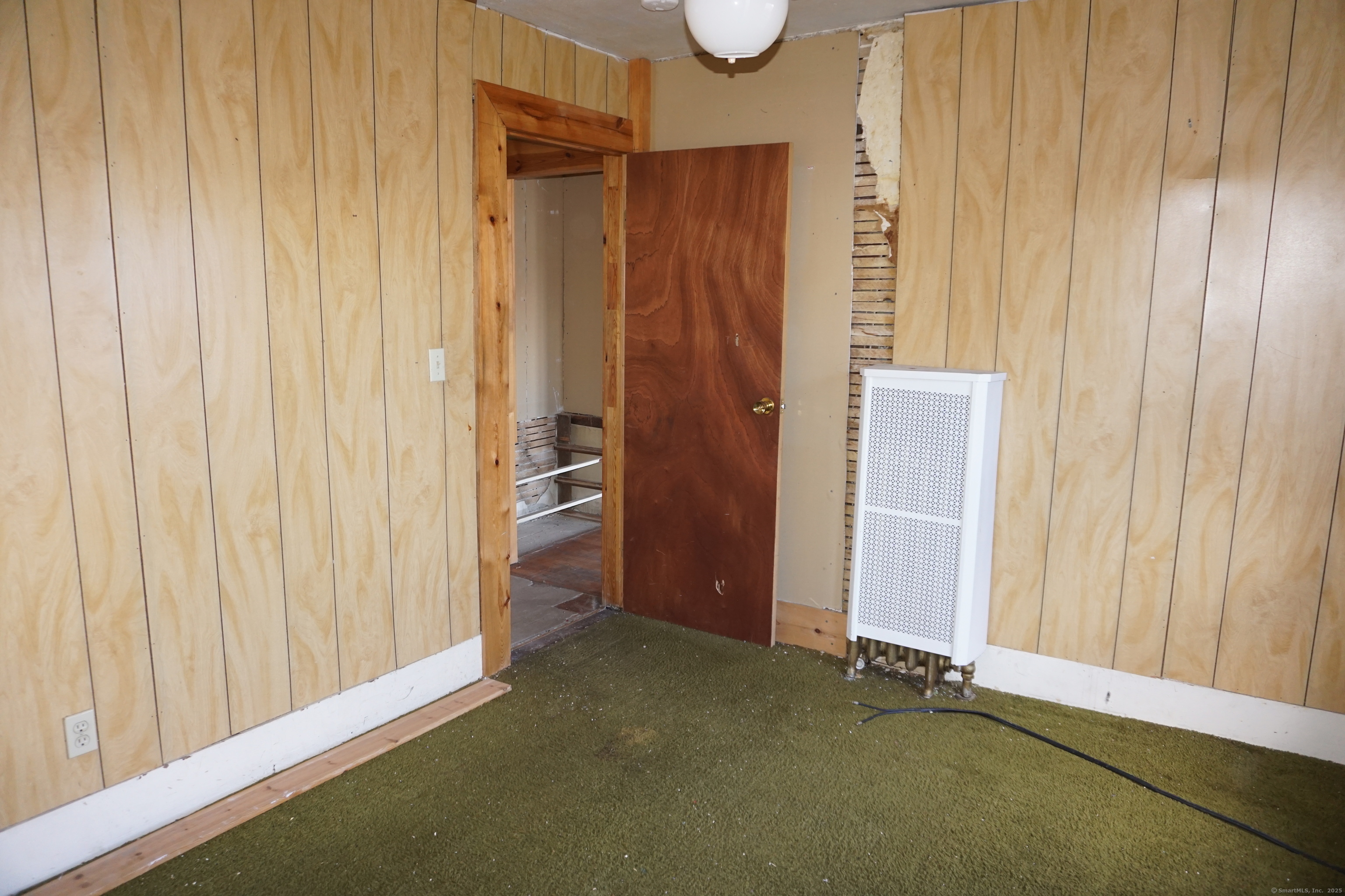 327 Orange Street Springfield, MA 01108 - Photo 21 of 32 a view of a room with wooden walls