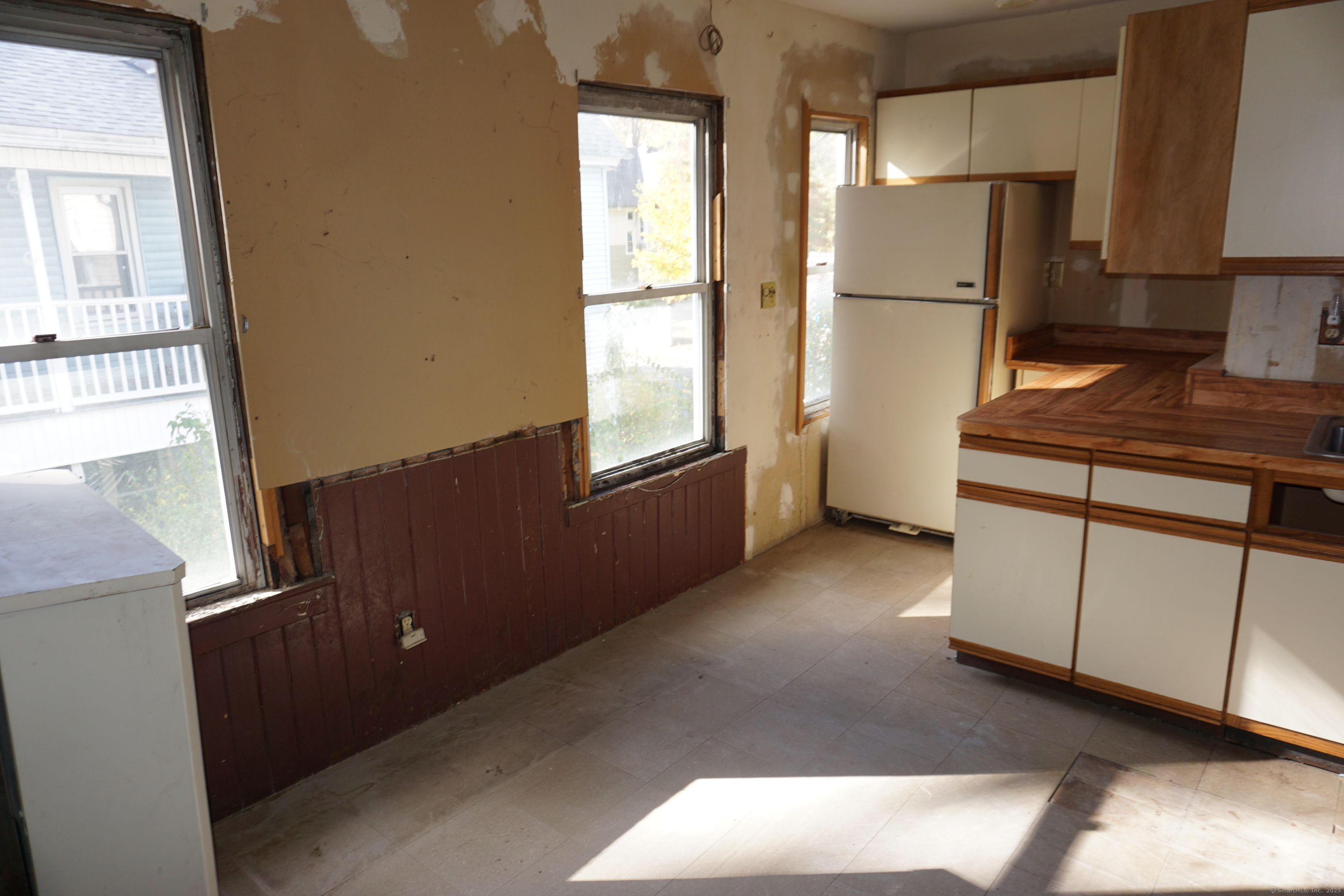 327 Orange Street Springfield, MA 01108 - Photo 28 of 32 a kitchen with appliances a window and a refrigerator