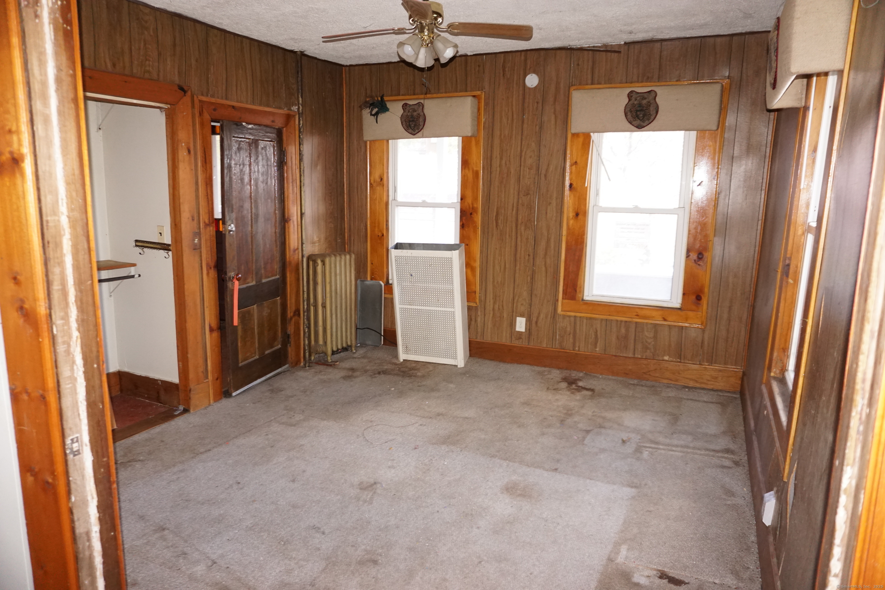 327 Orange Street Springfield, MA 01108 - Photo 7 of 32 an empty room with windows and closet area