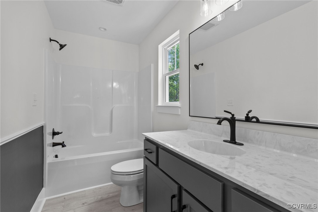 726 Stoney Point Road Cumberland, VA 23040 - Photo 19 of 32 a bathroom with a sink a toilet and shower