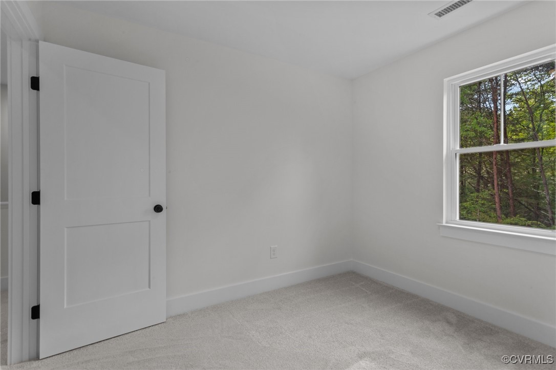 726 Stoney Point Road Cumberland, VA 23040 - Photo 23 of 32 an empty room with a window