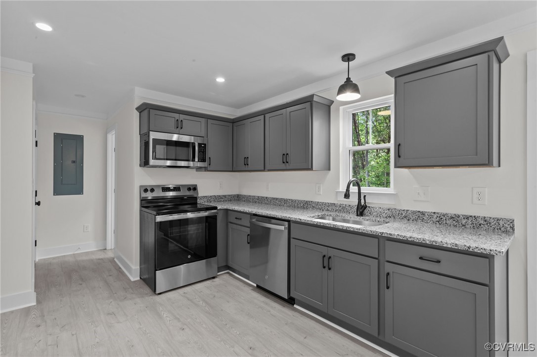 726 Stoney Point Road Cumberland, VA 23040 - Photo 7 of 32 a kitchen with stainless steel appliances granite countertop a sink and a stove