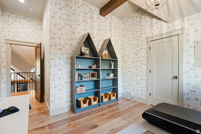 1141 South Oak Leaf Lane Springville, UT 84663 - Photo 81 of 147 Room featuring patterned wall covering, wood-finish flooring, a built-in house-shaped shelving unit, and a solid interior door