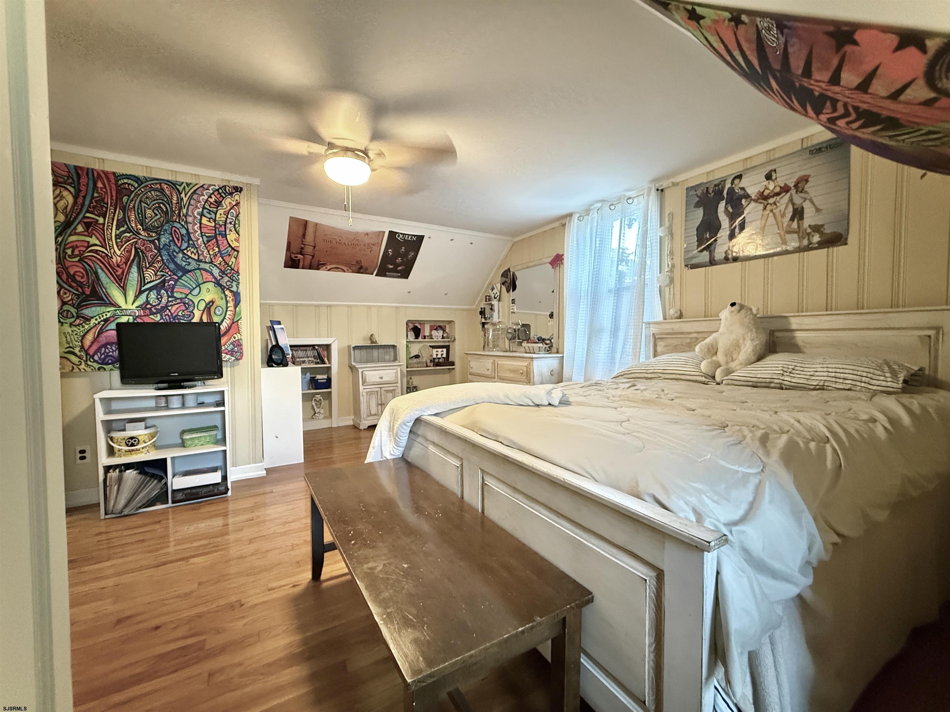 605 Shore Road Linwood, NJ 08221 - Photo 71 of 99 a spacious bedroom with a bed and a flat screen tv