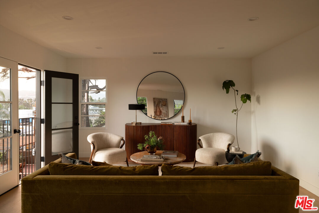 1016 Manzanita Street Los Angeles, CA 90029 - Photo 1 of 35 a living room with furniture and a fireplace