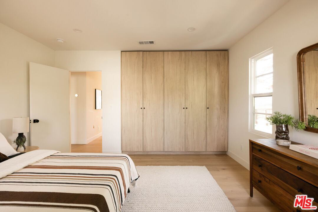1016 Manzanita Street Los Angeles, CA 90029 - Photo 17 of 35 a bedroom with a bed and a dresser