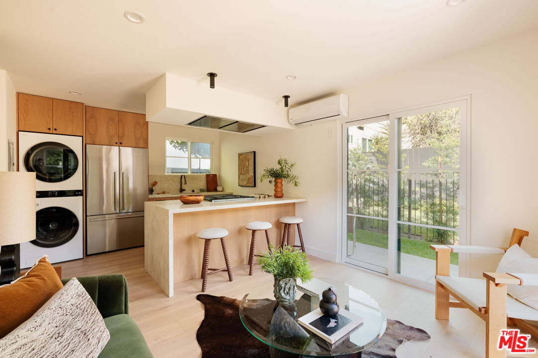 1016 Manzanita Street Los Angeles, CA 90029 - Photo 24 of 35 a living room with furniture and a large window