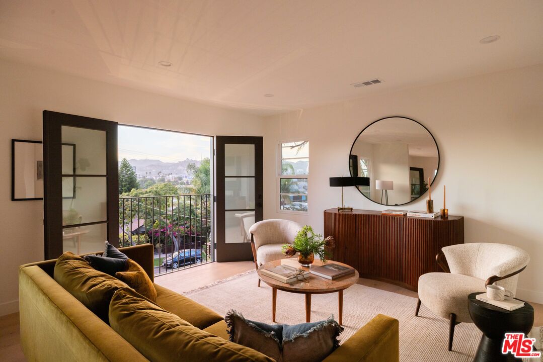 1016 Manzanita Street Los Angeles, CA 90029 - Photo 4 of 35 a living room with furniture and a large window