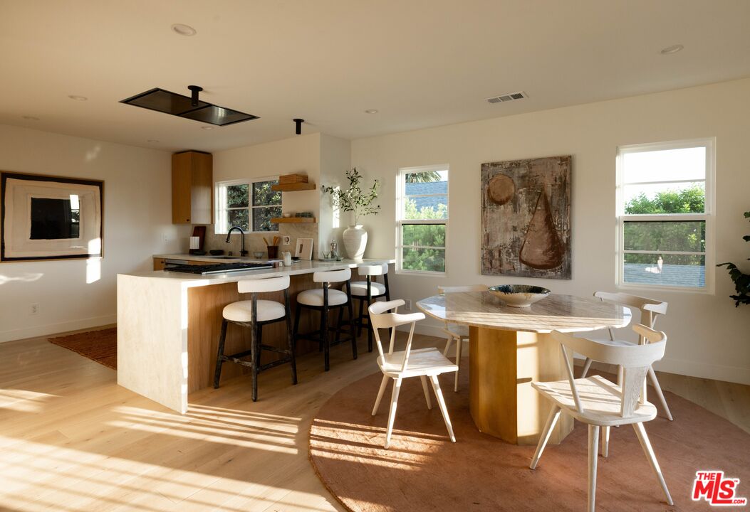 1016 Manzanita Street Los Angeles, CA 90029 - Photo 7 of 35 a view of a dining room with furniture window and wooden floor